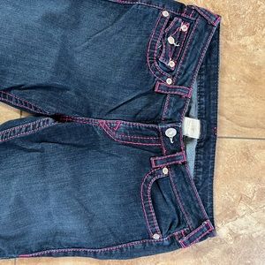 True Religion women’s denim stretch jean with hot pink stitching.